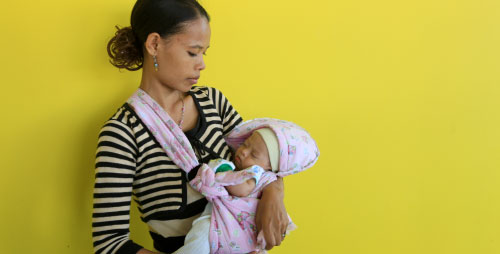 A mother and her newborn child at the new hospital in Suai, Timor-Leste.