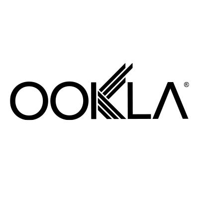 The image shows the Ookla logo. The word "OOKLA" is written in black, stylized uppercase letters on a light gray background. The second "O" is merged with a "K" formed by three diagonal lines, giving the logo a distinctive design.