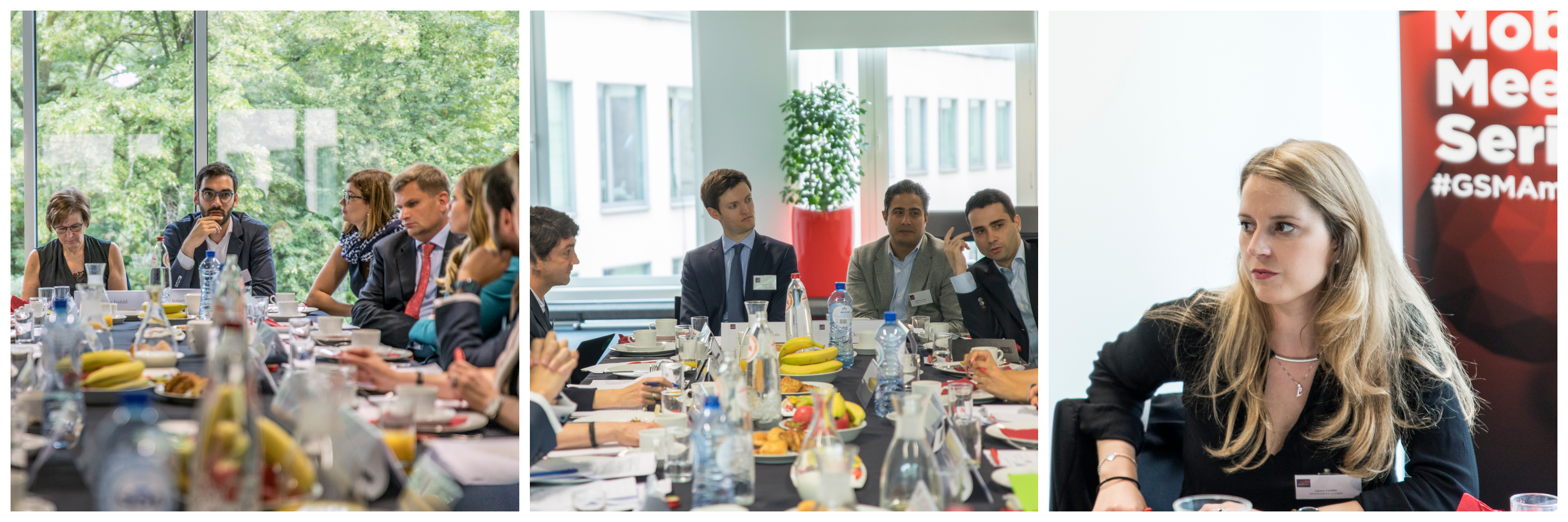 A group of professionals sits around a conference table with papers, fruit, and drinks. Some listen intently while others speak. In a separate shot, a blonde woman with a badge listens attentively. Large windows and conference banners are visible in the background.