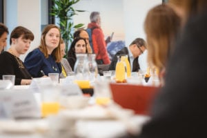 A group of people sitting at a table.