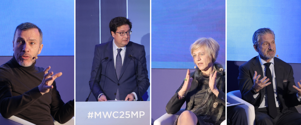 A panel of four business professionals engaging in a discussion. The first person wears a dark sweater, speaking passionately. The second in a suit stands at a podium marked "#MWC25MP." The third, a woman in a dark outfit, gestures as she responds. The fourth, also in a suit, speaks expressively.