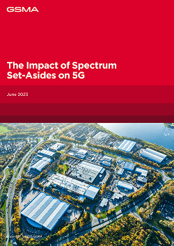 A report cover with a red header displaying "GSMA" and the title "The Impact of Spectrum Set-Asides on 5G," dated June 2023. Below is an aerial view of an industrial complex surrounded by trees, water, and roads, under a clear sky.