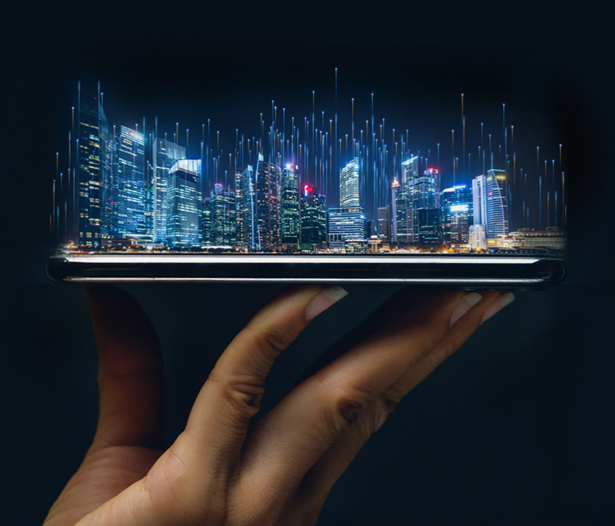 A hand holds a mobile phone displaying a holographic cityscape with glowing skyscrapers and vertical light beams, symbolising 6 GHz mobile technology and futuristic smart cities.