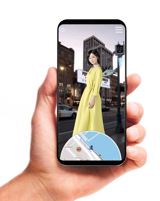 A hand holds a smartphone displaying a woman in a long yellow dress overlaid on a city street scene. Buildings with lights and a billboard are visible in the background. The screen features a circular map at the bottom, hinting at augmented reality or navigation functionality.