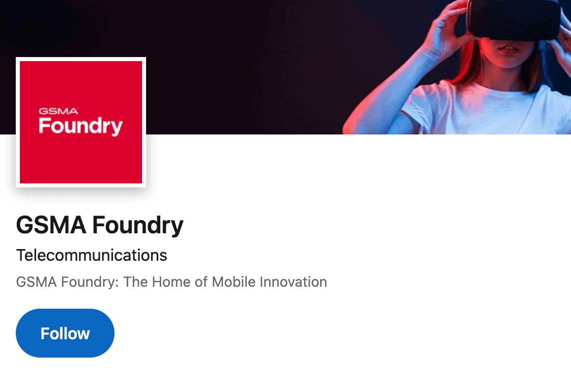 A young woman wearing a VR headset extends her arms, illuminated by blue and red lighting. The GSMA Foundry logo appears in the top left. The page heading reads "GSMA Foundry" with a description: "The Home of Mobile Innovation." A blue "Follow" button is below.