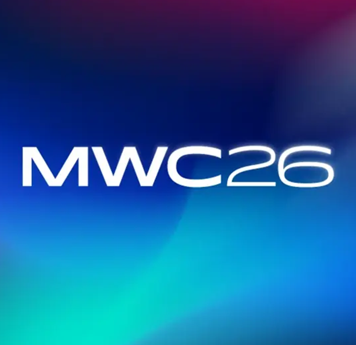 White text reading “MWC26” is centred on a gradient of blue, teal, purple, and pink hues. The modern, clean style—reminiscent of CircuitX branding—suggests a tech or event theme, likely referencing the Mobile World Congress 2026.