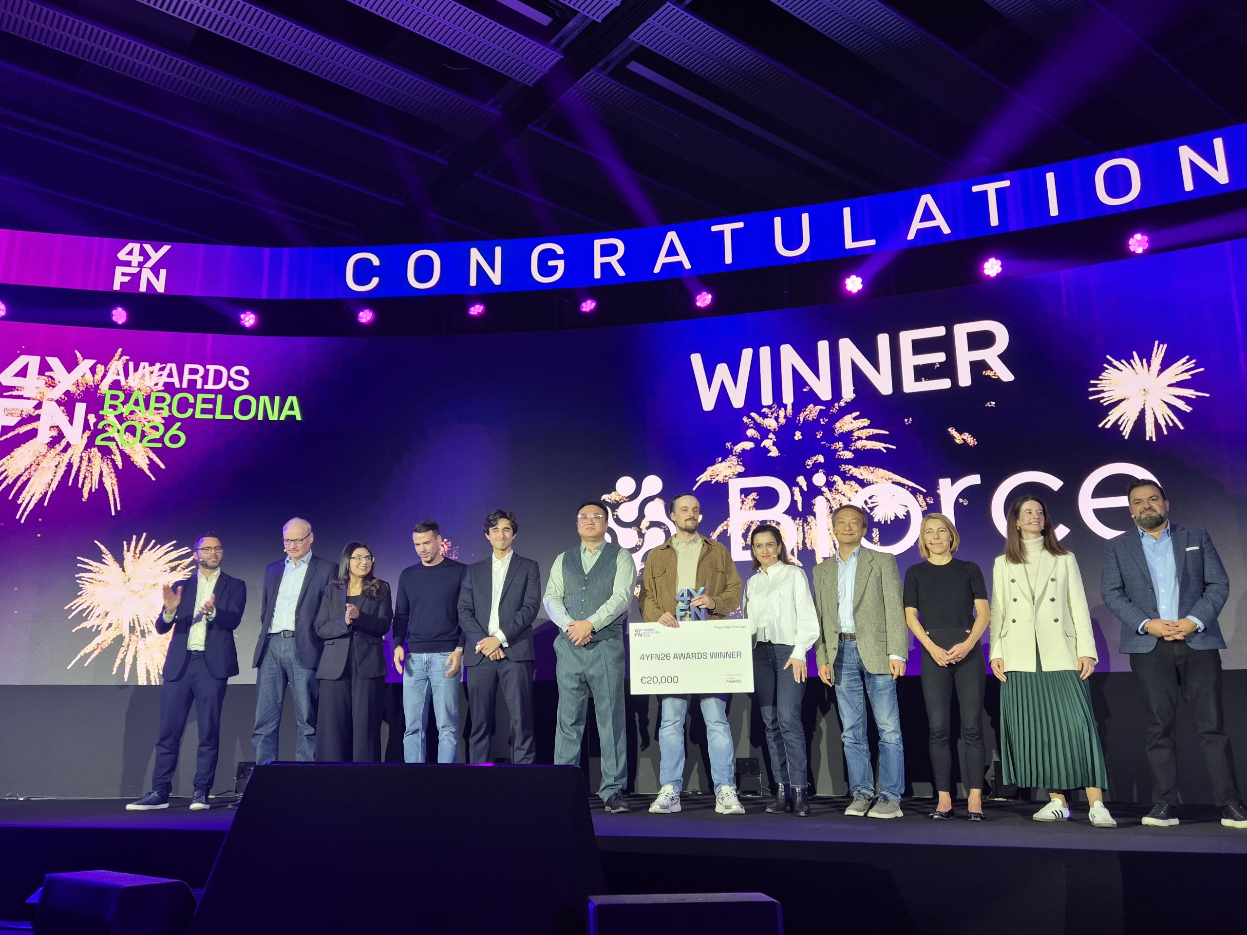 A group on stage at the 4YFN Awards in Barcelona 2024, celebrating with a sign reading "Winner Biome.