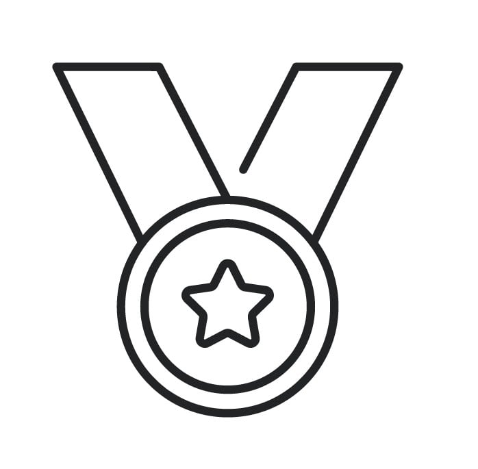 A simple black and white line drawing of a medal. The medal has a circular shape with a five-pointed star in the centre, and two ribbon ends extending upward from the top of the medal. The design is minimalistic and uncoloured.