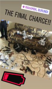 A number of phones plugged into charges devices, geotagged Makamba, Burundi