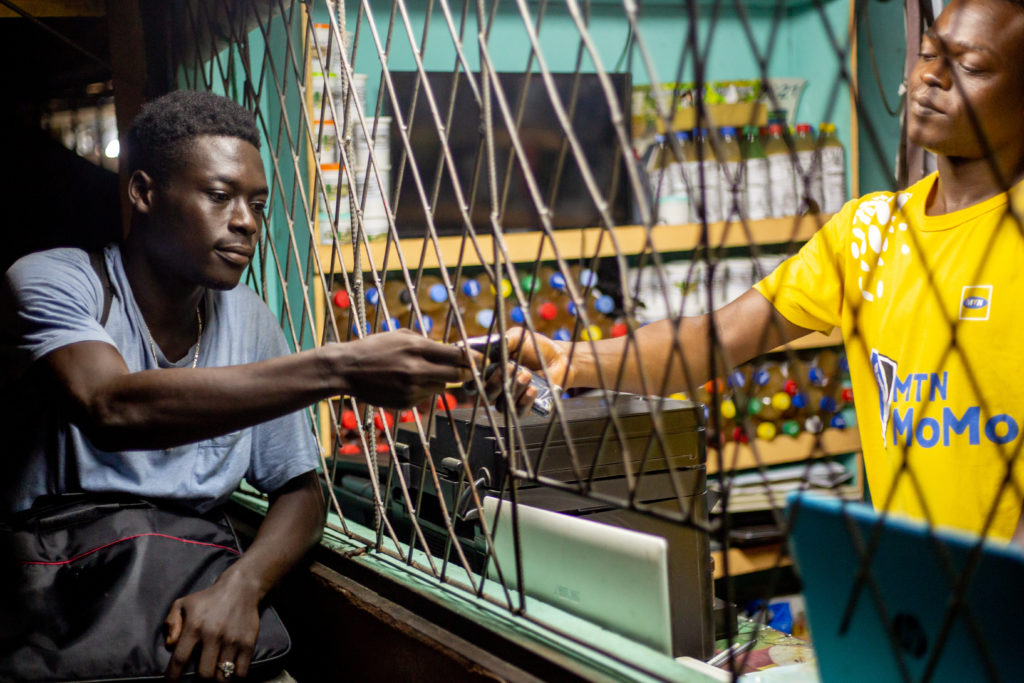 Photo of person paying for mobile services
