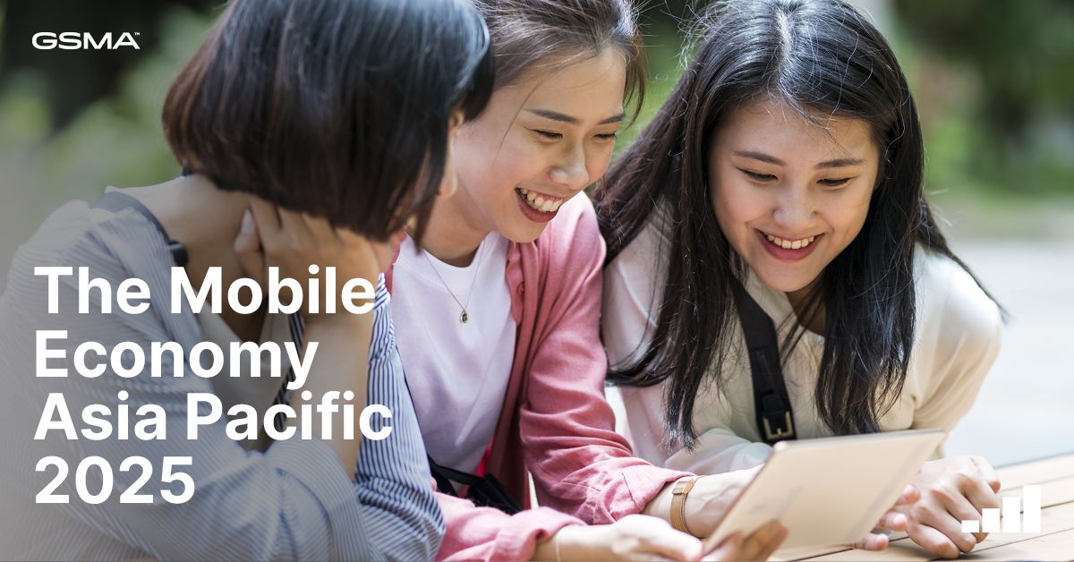 Three young women sit closely together outdoors, smiling and looking at a tablet. The text reads “The Mobile Economy Asia Pacific 2025” with the GSMA logo in the top left corner. The mood is cheerful and collaborative, suggesting technology and connectivity.