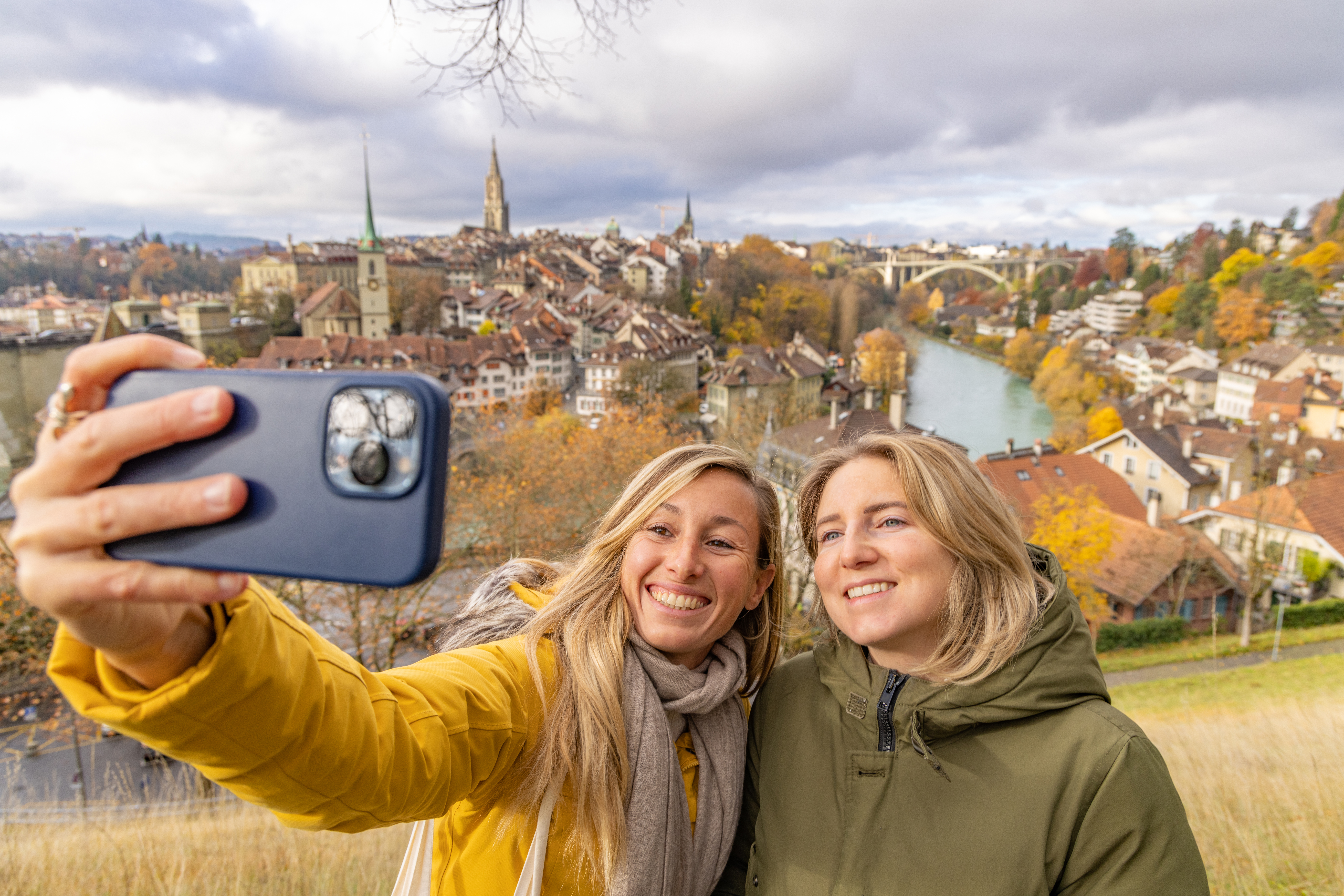 Two female friends taking selfie in Bern Switzerland