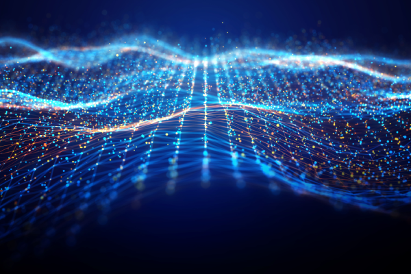 A digital landscape of glowing blue and orange light particles forms a flowing, interconnected grid over a dark blue background. The mesh waves like a gentle sea, with bright points of light at each intersection creating a sense of depth and data-driven motion.