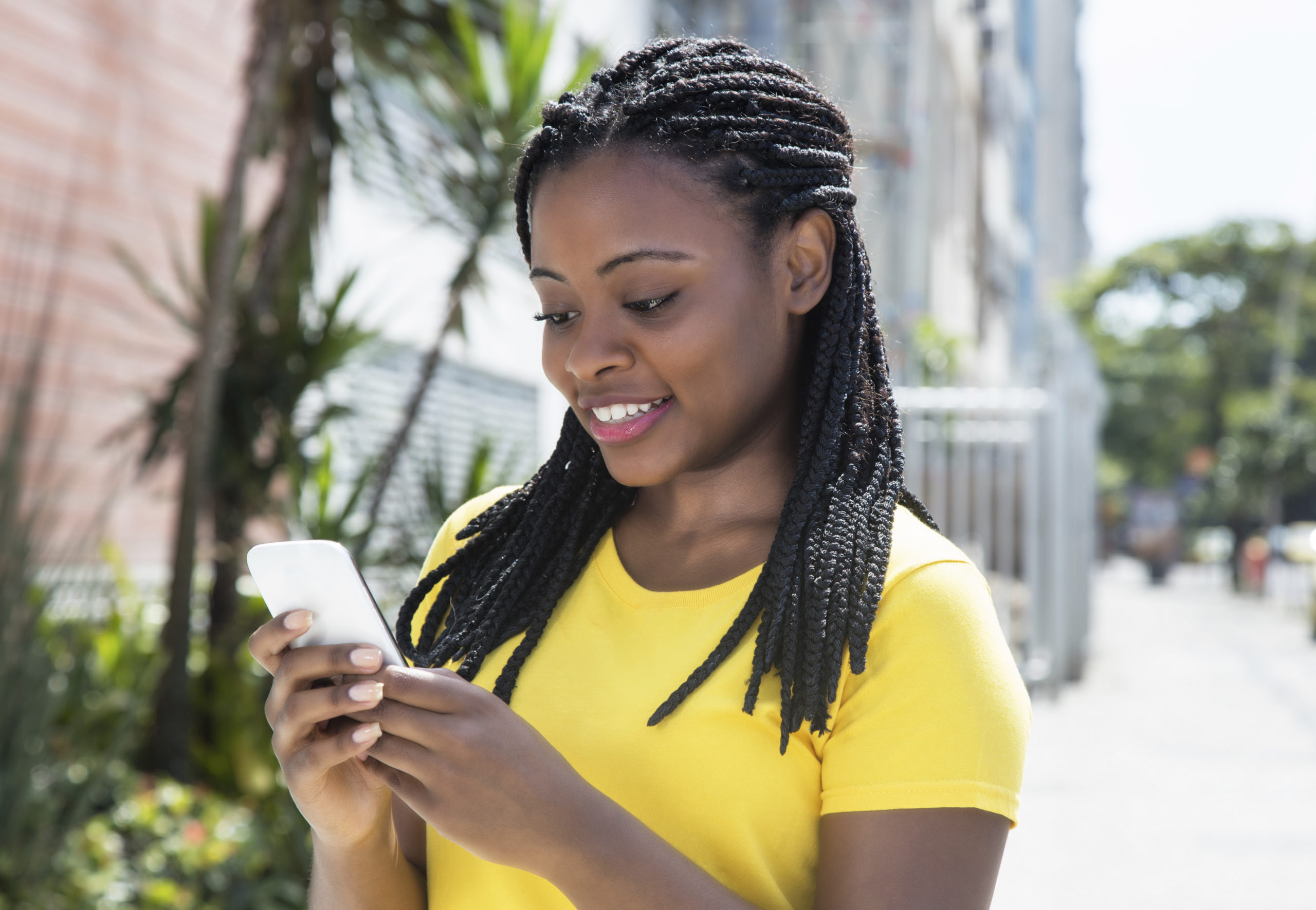 African-american-woman-texting-message-with-mobile-phone