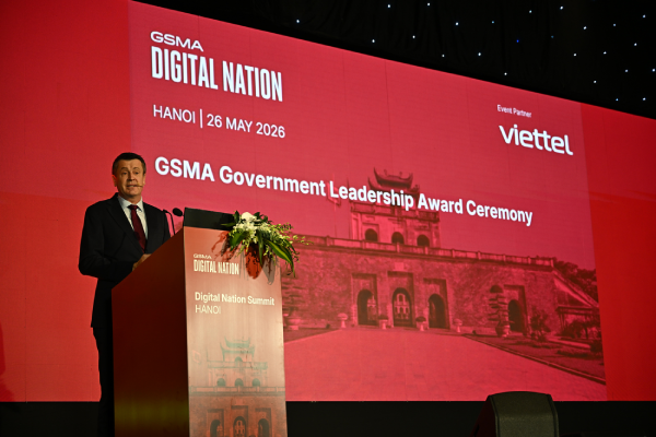 A man speaks at a lectern during the GSMA Government Leadership Award Ceremony in Hanoi, May 2026.
