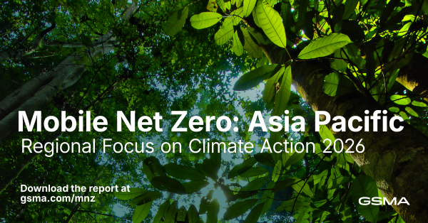 View looking up at a green forest canopy with sunlight shining through leaves. Large white text reads, “Mobile Net Zero: Asia Pacific Regional Focus on Climate Action 2026.” Lower text: “Download the report at gsma.com/mnz.” GSMA logo in the corner.