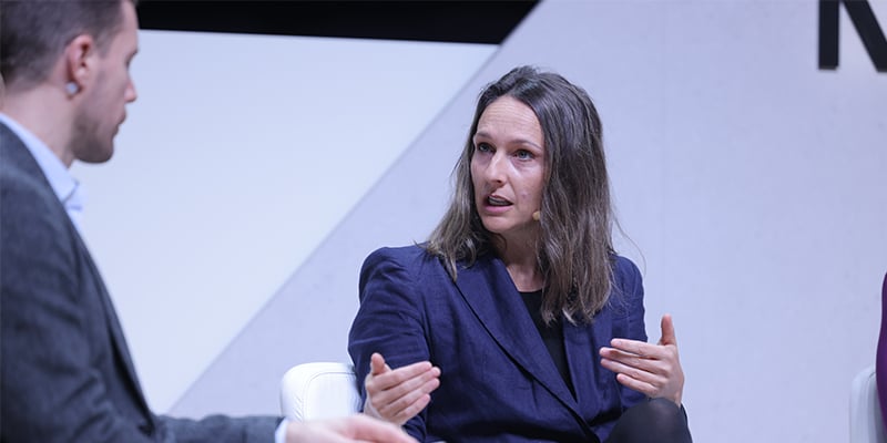 Laura from Telefónica discussing telecom sustainability ROI at MWC Barcelona 2026.