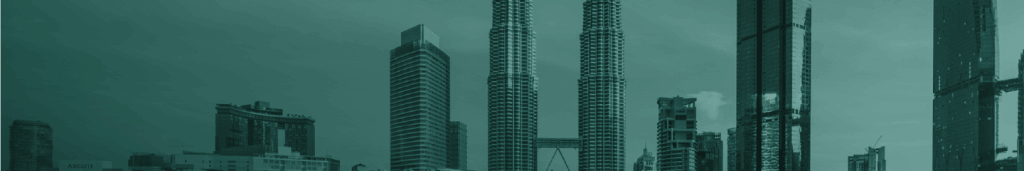 A city skyline featuring modern skyscrapers, including twin cylindrical towers with a skybridge symbolising urban connectivity, a tall rectangular glass building, and various other high-rise structures under a mostly cloudy sky. The image has a greenish monochrome filter.