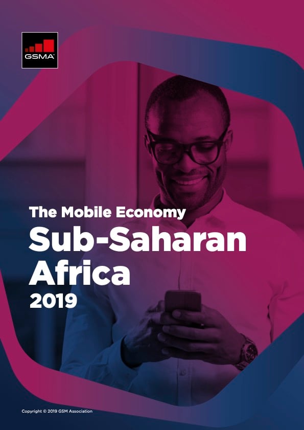 Cover of a report titled “The Mobile Economy Sub-Saharan Africa 2019” by GSMA. It shows a smiling man wearing glasses and a button-down shirt, looking at his mobile phone. The background has shades of purple and blue geometric shapes.