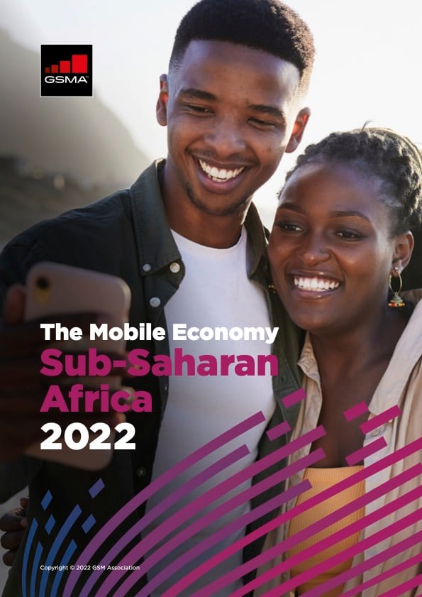 A smiling man and woman take a selfie together outdoors. The cover text reads "The Mobile Economy Sub-Saharan Africa 2022" with the GSMA logo in the top left. Pink and purple diagonal lines decorate the bottom of the image.