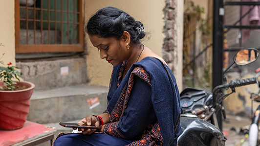 Indian woman using mobile internet