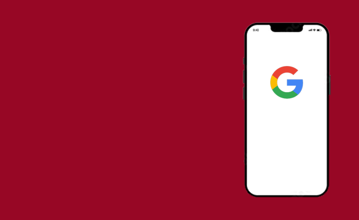 Smartphone displaying the google logo on its screen against a red background.