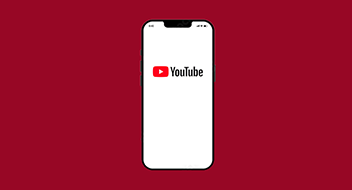 A smartphone displaying the youtube logo on its screen against a red background.