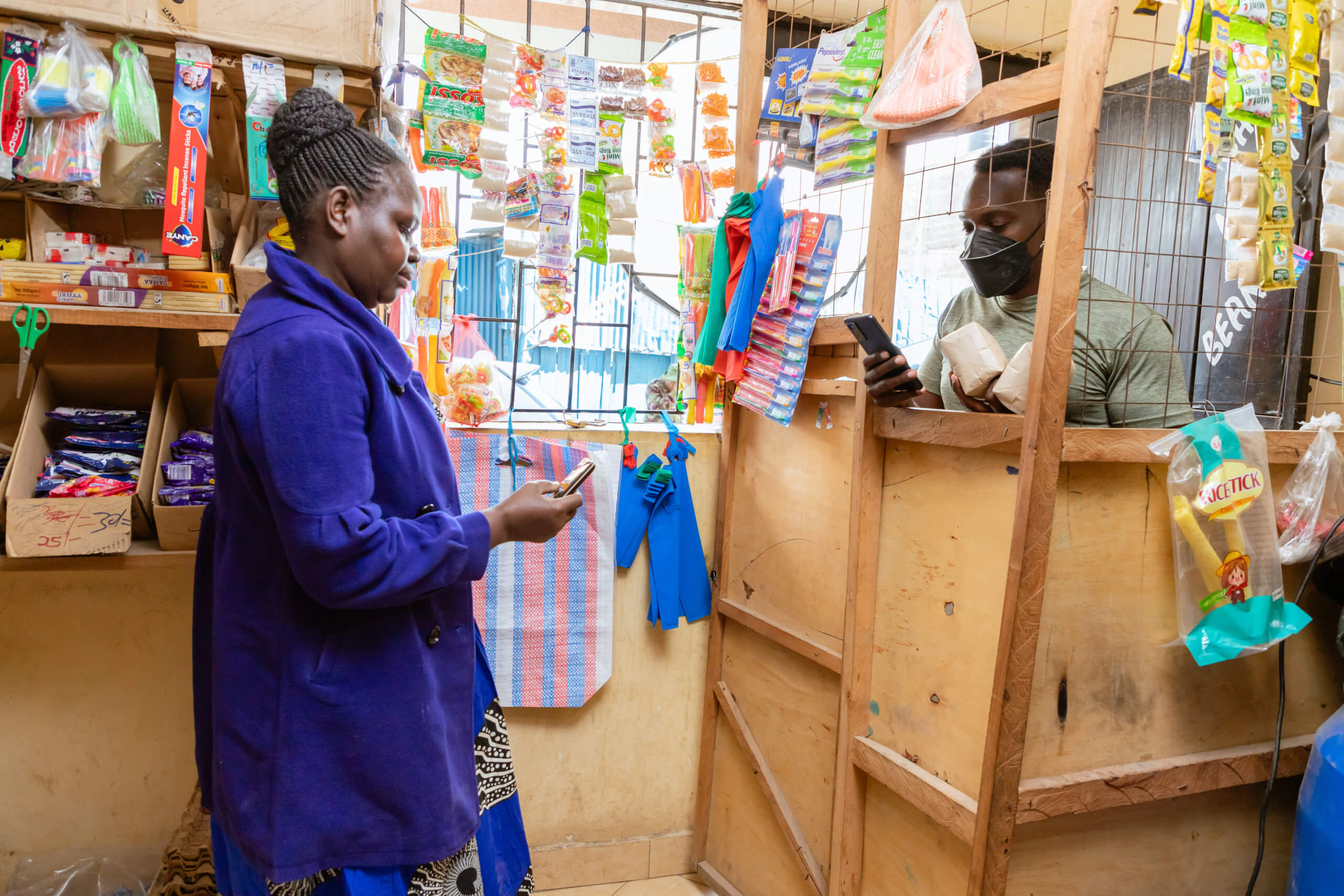 A micro-merchant in Kenya efficiently manages her business operations using her mobile phone. With strong digital financial literacy skills, she tracks sales, makes secure transactions via mobile money, and confidently grows her business, paving the way for long-term success.