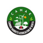 A circular logo with a green background. "CAMAK" is written at the top, and "Carbon Markets Association of Kenya" is around the bottom edge. Inside are images of wind turbines, solar panels, trees, people, and a sun, symbolizing renewable energy and community.