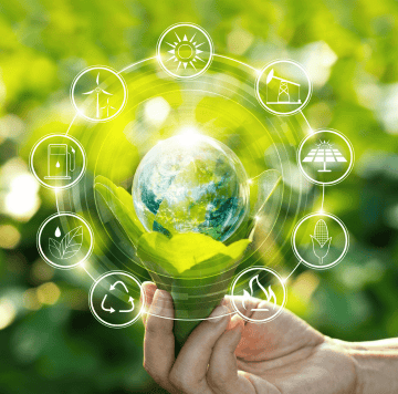 A hand holds a green leafy plant with a glass globe in the center. Surrounding it are icons for renewable energy, recycling, and sustainable agriculture, highlighting ClimateTech innovations driving environmental protection and sustainability.
