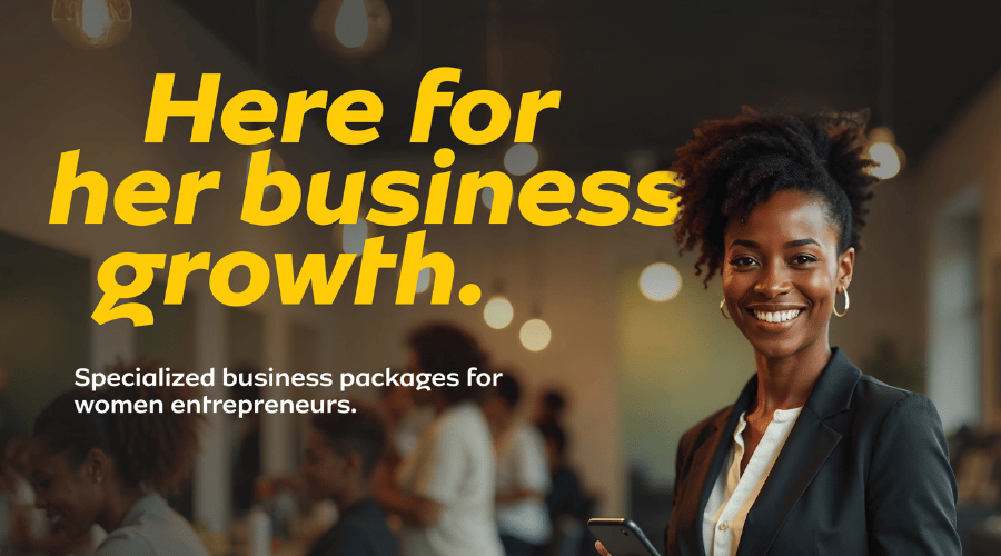 A smiling woman in a business suit holds a phone in a modern office. Bold yellow text reads, “Here for her business growth.” White text below says, “Specialised business packages for women entrepreneurs with MTN Ghana Adwumapa.” People work in the blurred background.