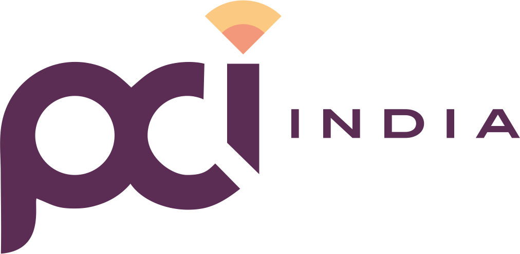 The image shows the PCI India logo in purple text. The “i” in “pci” features an orange and yellow arc above it, resembling a wi-fi signal. The word “INDIA” appears in uppercase letters to the right of the “pci” text.