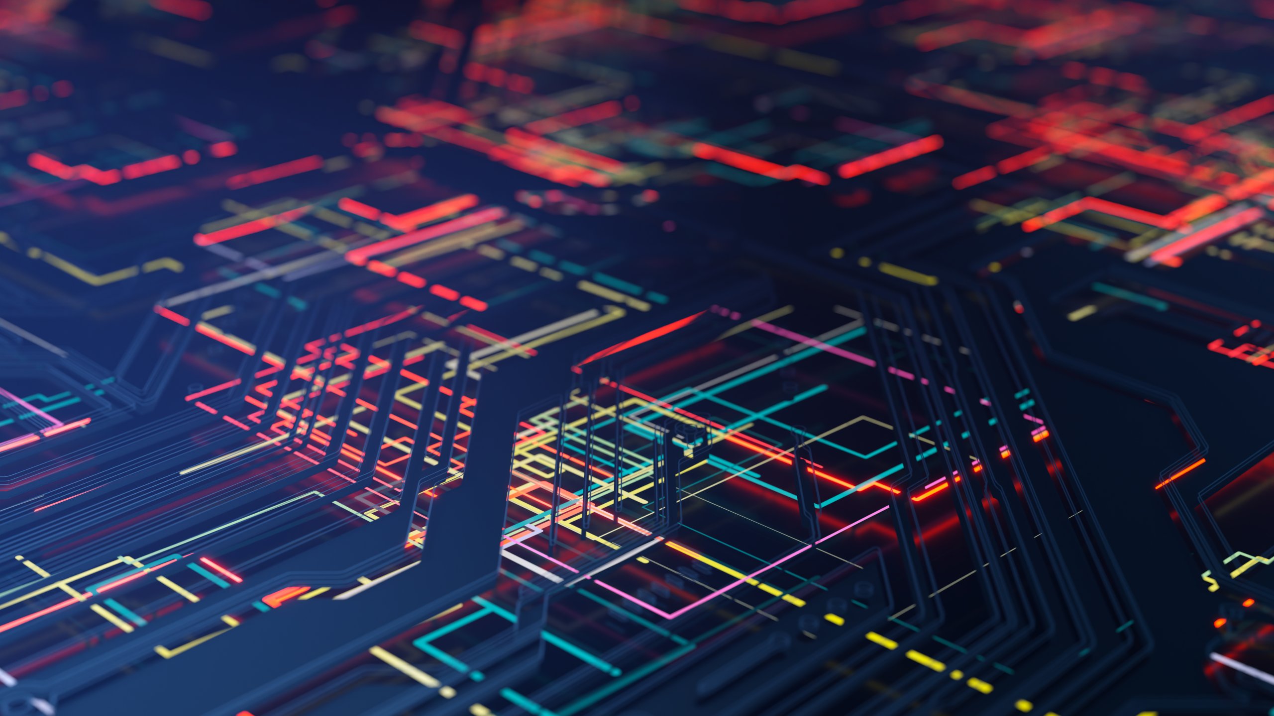 Abstract digital circuit board with complex, glowing neon lines in red, orange, yellow, green, and blue on a dark background. The 3D perspective gives depth and a futuristic, technological feel, with intersecting patterns resembling a cityscape of illuminated circuits.