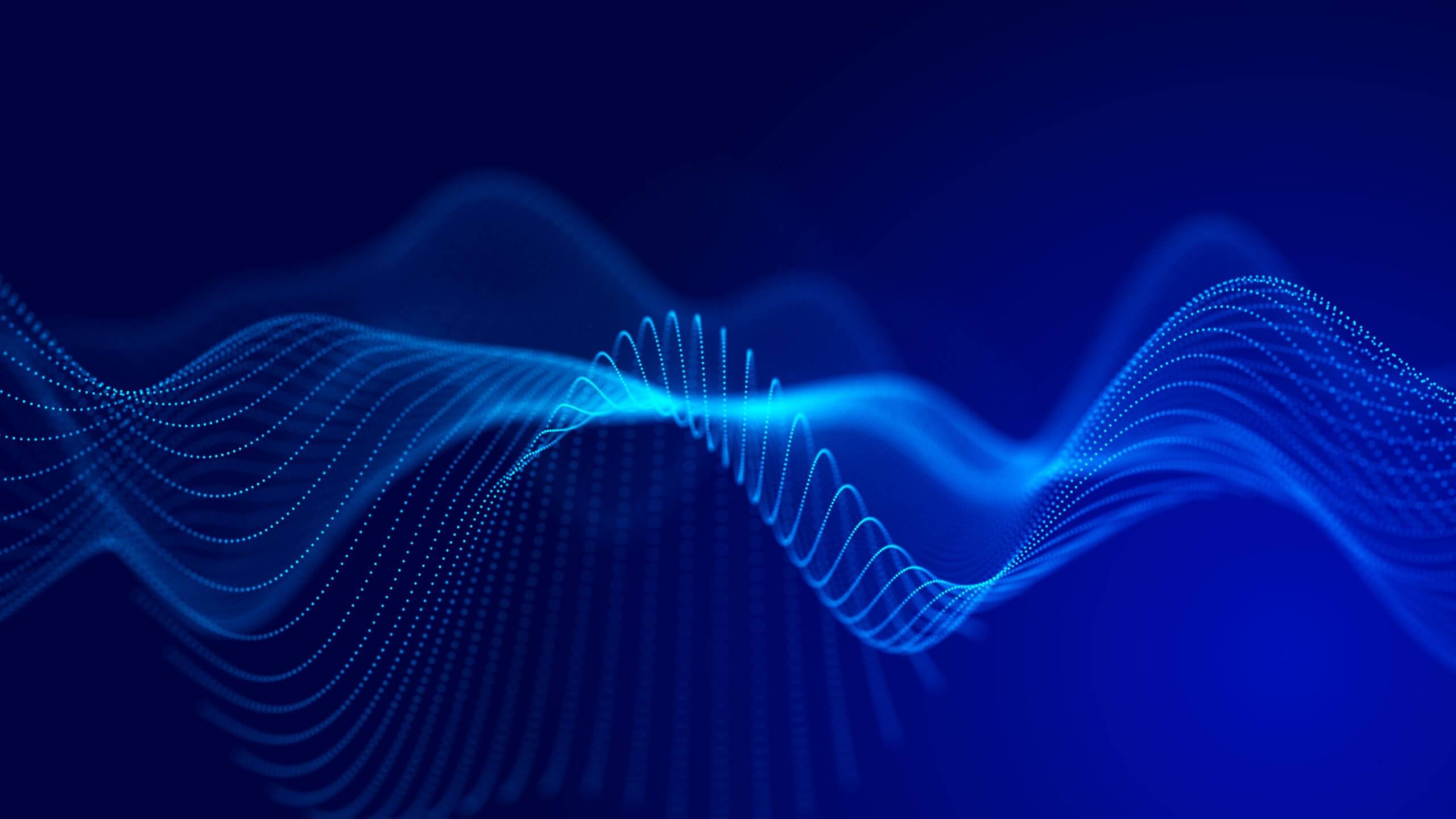 Abstract digital image showing blue, flowing waveforms made of glowing lines and dots against a dark blue background. The dynamic waves evoke the flow of data, reflecting themes relevant to GSMA Public Policy in connectivity and communication.