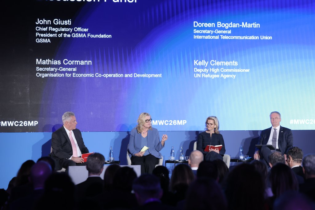Four panelists in professional attire sit on stage discussing key Ministerial Programme 2026 takeaways at a conference, with the audience visible in the foreground.
