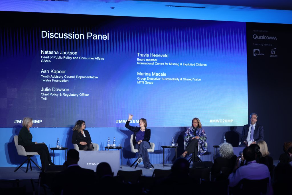 Five panelists sit on stage discussing, with a large screen behind them displaying their names and affiliations, as they share key Ministerial Programme 2026 takeaways.