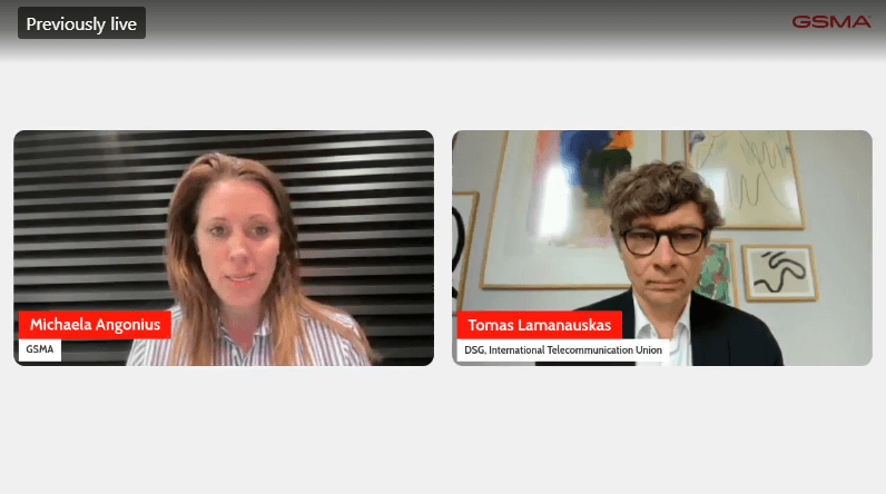Two people on a video call: a woman with long hair and striped shirt on the left, a man with glasses and dark jacket on the right. Both have name and organization labels, discussing satellite policy. “Previously live” and “GSMA” appear at the top. Backgrounds are simple.