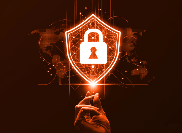 A hand touches a glowing digital shield with a padlock icon in the center, symbolizing cybersecurity. The shield is overlaid with network lines and dots, and a faint world map is visible in the background. The image uses a red-orange color scheme.