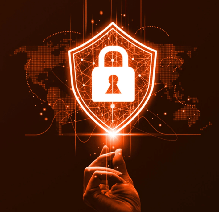 A hand reaches toward a glowing digital shield with a padlock symbol, set against a world map background. The image uses orange hues, suggesting cybersecurity, data protection, and secure technology. Lines and nodes evoke global digital connections, visually representing the statement of requirements for robust information security on an international scale.