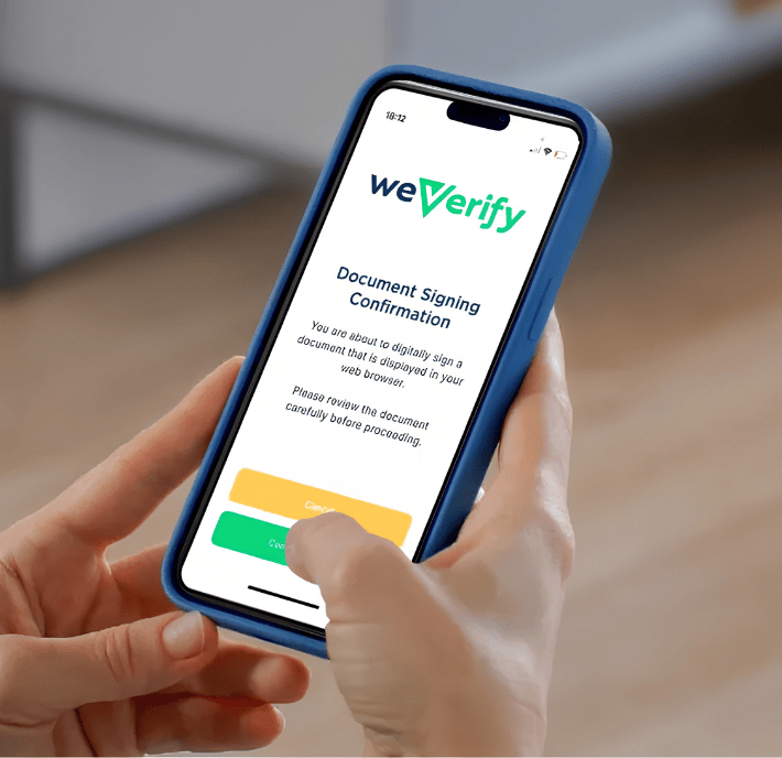 A person holds a smartphone displaying a screen from the “weVerify” app, showing a document signing confirmation and the statement of requirements. The phone is in a blue case, and the person uses their right thumb to tap a yellow “Continue” button on the screen. The background is blurred.