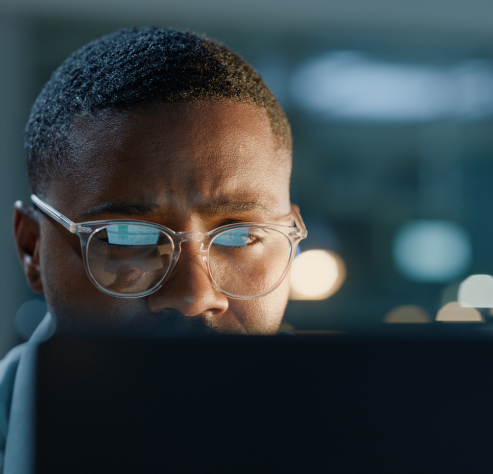 man looking at computer