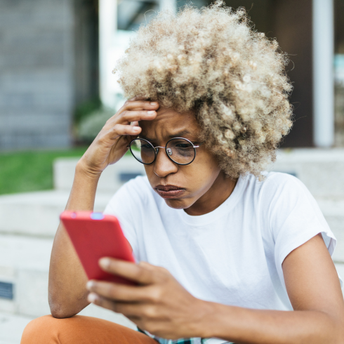 lady stressed at phone