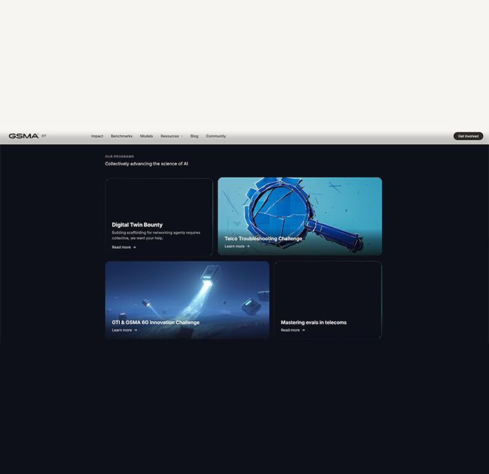 A dark-themed website page shows four science and technology article preview cards with images and titles, featuring topics like Artificial Intelligence LLMs and Open Telco AI Benchmarks.