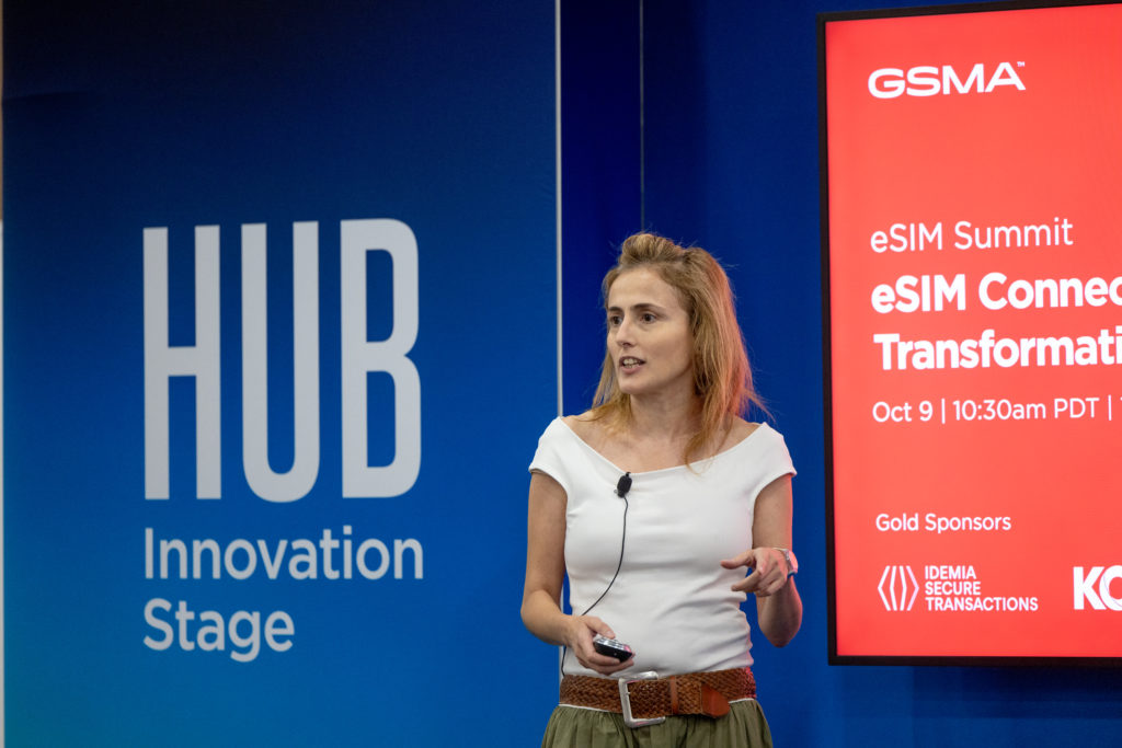 A speaker address the audience on stage