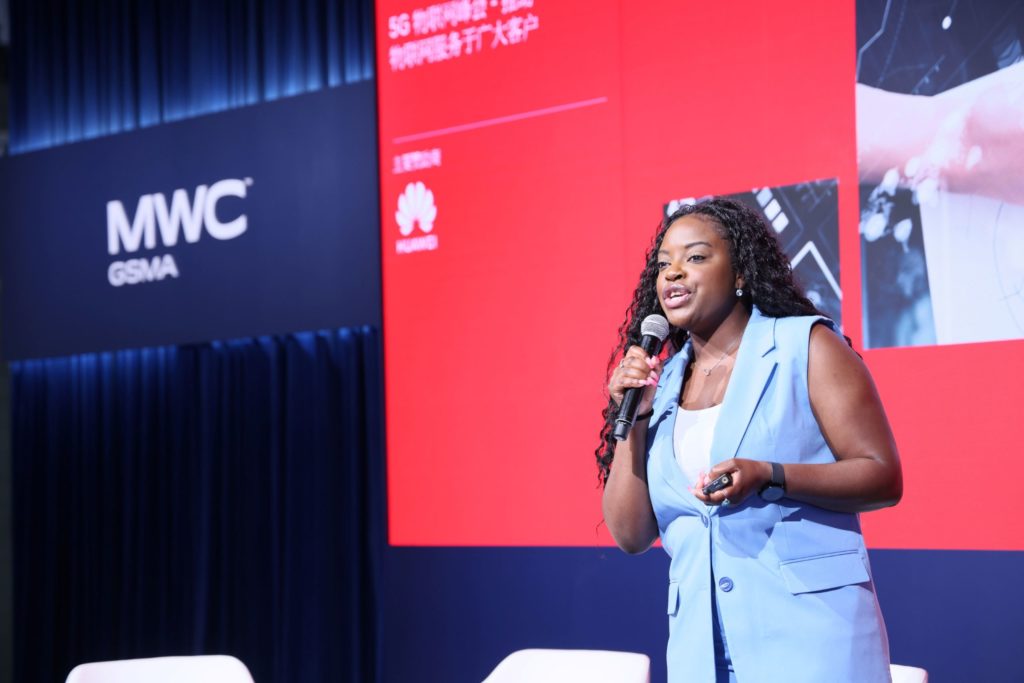 A woman speaking on stage