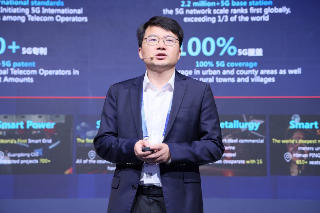 A man on stage speaking
