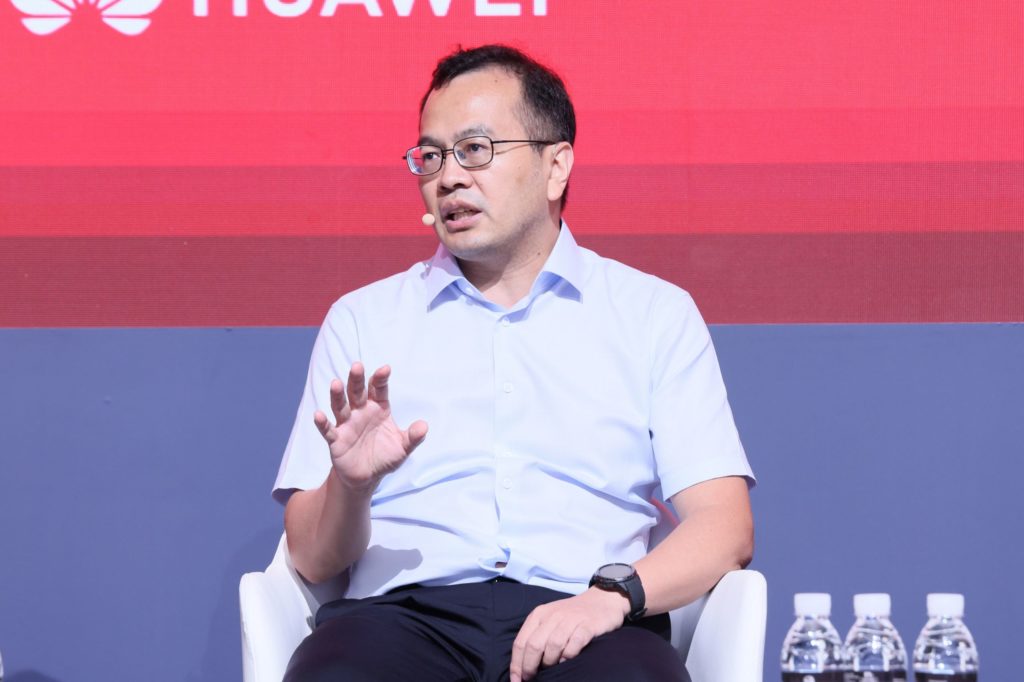 A man sitting on stage talking