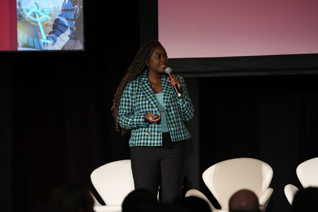 Woman on stage speaking