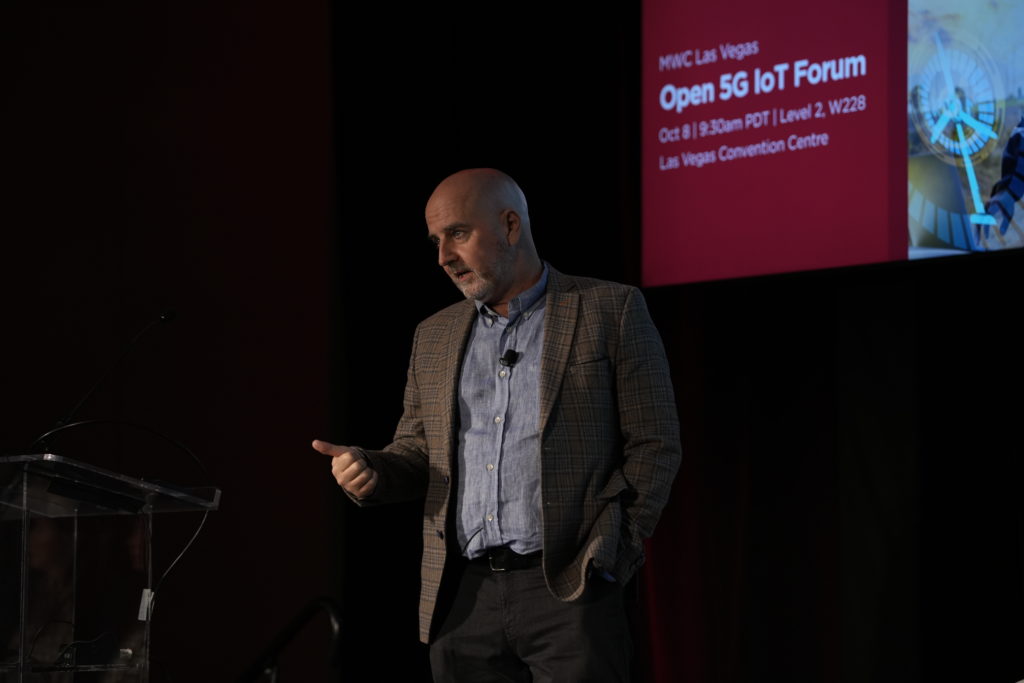 A man on stage speaking
