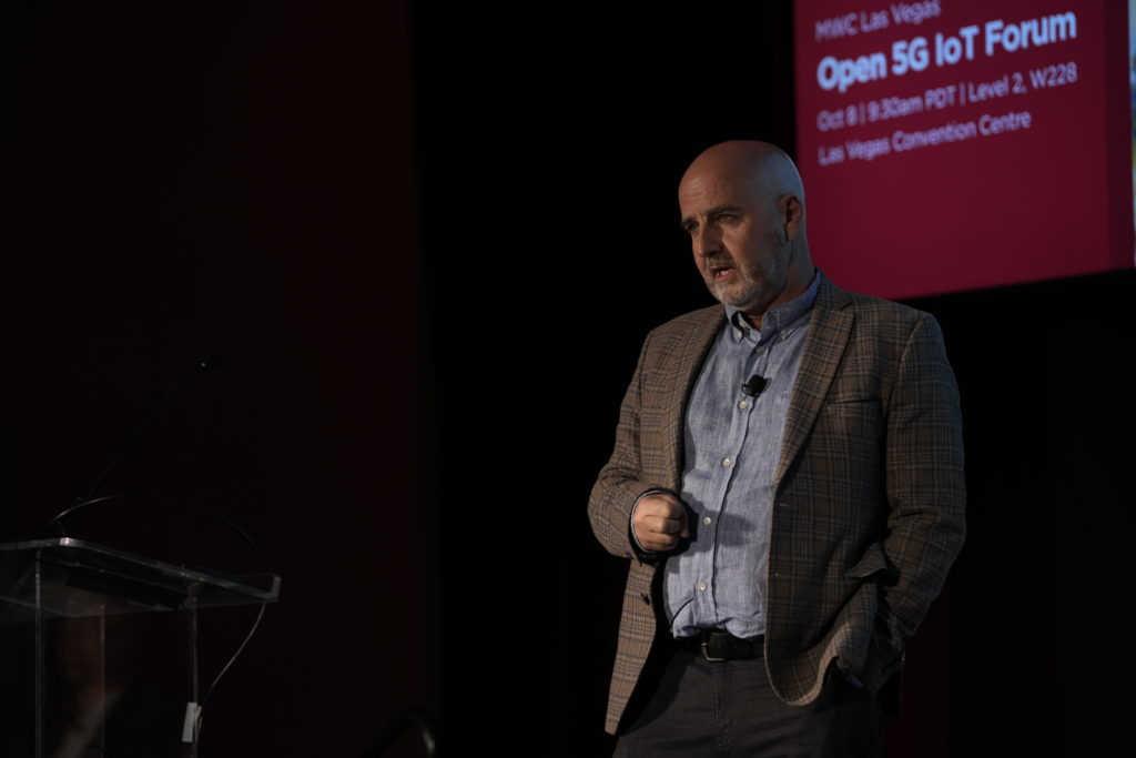 A man on stage speaking